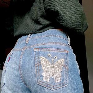 Levi’s light wash midrise bootcut jeans with rhinestone butterfly on back pocket